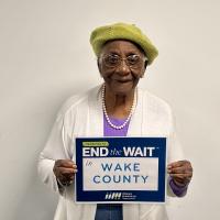 Meet Mrs. Alice, who celebrated her 96th birthday in February. A member of the White Oak Friendship Cafe for three years, she grew up in the Green Level community and has witnessed its transformation from farmland to suburban neighborhoods. Although she can no longer cook, she appreciates the meals provided and values the social connections she makes, sharing her life experiences, including overcoming struggles during the Civil Rights movement. She strives each day to make her community better.